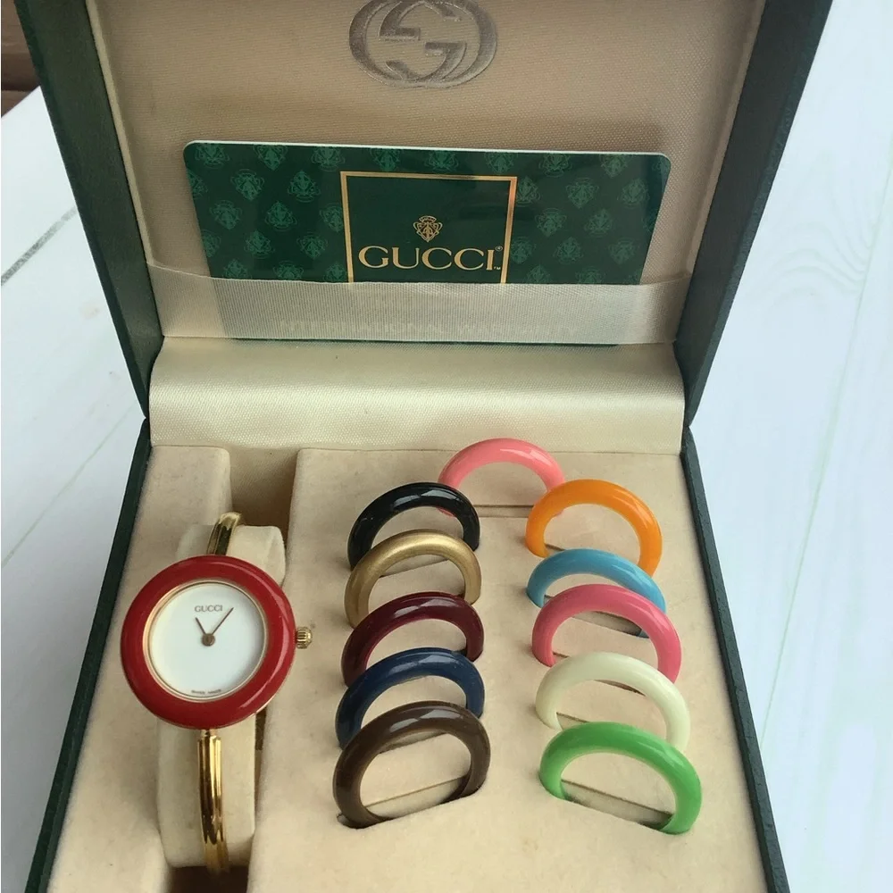 Gucci Women’s Gold Bangle Watch with Interchangeable Color Bezels